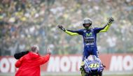 Italy's Valentino Rossi celebrates after winning the Assen Motorcycling Grand Prix at the TT circuit in Assenon on June 25, 2017. (AFP / ANP / Vincent Jannink)