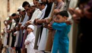 Men and children attend the Eid al-Fitr prayers to mark the end of the holy fasting month of Ramadan at a mosque in Rawalpindi, Pakistan June 26, 2017. REUTERS/Faisal Mahmood