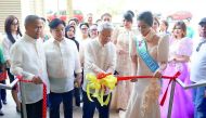 Philippine Ambassador Alan L Timbayan (second right) cutting the ribbon while Labour Attaché David Des Dicang (second left), UFOQ Chairman Ressie Fos (left) and Mutyang Pilipinas Tourism International 2016 Justine Mae San Jose look on at the opening of th