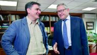 Greek's Finance Minister Euclid Tsakalotos (left) speaks with Managing Director of the European Stability Mechanism , Klaus Regling, in his office in Athens, yesterday.