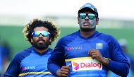 Sri Lankan cricket captain Angelo Mathews (right) warms up with team-mate Lasith Malinga during a practice session at Galle International Cricket Stadium in Galle yesterday.