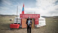 A man leaves after voting in the Mongolian presidential election at the Erdene Sum Ger (Yurt) polling station in Tuul Valley on June 26, 2017. AFP / Fred DUFOUR