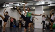 In this picture taken June 27, 2017, Indian ballet dancer Amiruddin Shah (in green) practises at a dance academy in Mumbai. AFP / PUNIT PARANJPE