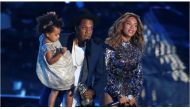 FILE PHOTO - Jay-Z with wife Beyonce as he holds their daughter Blue Ivy during the 2014 MTV Video Music Awards in Inglewood, California. REUTERS/Mario Anzuoni/File Photo