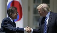 U.S. President Donald Trump (R) greets South Korean President Moon Jae-in prior to delivering a joint statement from the Rose Garden of the White House in Washington, U.S., June 30, 2017. (REUTERS/Jim Bourg)