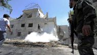 An army soldier secures the area of a blast site in the Baytara traffic circle near the Old City of Damascus, Syria July 2, 2017. REUTERS/Omar Sanadiki.