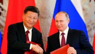 Russian President Vladimir Putin (right) shakes hands with his Chinese counterpart Xi Jinping during a signing ceremony following the talks, on a wide-range of issues, including, economic, trade, investment, diplomacy and politics, at the Kremlin in Mosco