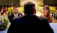 Handout picture released by WWW.MESSI.COM showing Argentine football star Lionel Messi and his bride Antonella Roccuzzo gesturing during the civil marriege ceremony at their wedding in Rosario, Santa Fe province, Argentina on June 30, 2017.