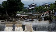 An area damaged by swollen river after heavy rain is seen in Asakura, Fukuoka Prefecture, Japan July 6, 2017. REUTERS/Issei Kato.