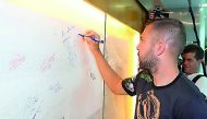 Barcelona's Spanish  defender Jordi Alba  signs on the wall of celebrities at the Aspire Academy during his recent visit to Doha.