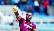 West Indies' Evin Lewis celebrates scoring a century during the T20 match against India at the Sabina Park Cricket Ground in Kingston, Jamaica on Sunday.