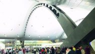 Passengers waiting for check-in at the departure lounge of Hamad International Airport.