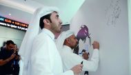 The officials of the QFC signing in the board to express their support for Qatar. 