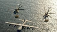 FILE PHOTO: Two U.S. Marine Corps CH-53E Super Stallion helicopters receive fuel from a KC-130 Hercules over the Gulf of Aden January 1, 2003. U.S. Marine Corps/Cpl. Paula M. Fitzgerald/Handout/File Photo via REUTERS.