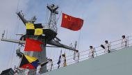 Soldiers of China's People's Liberation Army (PLA) stand on a ship sailing off from a military port in Zhanjiang, Guangdong province, July 11, 2017. (REUTERS)