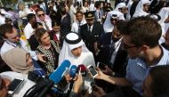 Qatar Airways Chief Executive Akbar al-Baker speaks to reporters after unveiling a commemorative signing wall in support of Qatar’s Emir Sheikh Tamim Bin Hamad Al-Thani in Doha, Qata, July 13, 2017. (REUTERS/Naseem Zeitoon)
