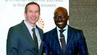 South Africa's finance minister, Malusi Gigaba (right), poses with Johannes Jordaan, an independent economist at Economic Modelling Solutions after he was named the Thomson Reuters economist of the year in Sandton, yesterday.