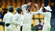 Zimbabwe’s captain Graeme Cremer (second right) celebrates with his team-mates after he dismissed Sri Lanka’s Niroshan Dickwella during the Second day of their one-off Test match at the R Premadasa Cricket Stadium in Colombo, yesterday. 