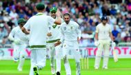 South Africa’s Keshav Maharaj (centre) celebrates bowling England’s Jonny Bairstow (right) for 45 runs on the second day of their second Test at Trent Bridge cricket ground in Nottingham, central England, yesterday. 