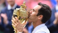  Switzerland's Roger Federer kisses the winner's trophy after beating Croatia's Marin Cilic in their men's singles final match, during the presentation on the last day of the 2017 Wimbledon Championships at The All England Lawn Tennis Club in Wimbledon, s