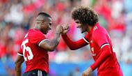 Manchester United’s Marouane Fellaini celebrates scoring a goal with Antonio Valencia.