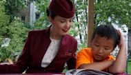 A staff of Qatar Airway interacting with a child during the Qatar Airways Summer Reading Program’ in New York City. 