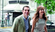 Greek Prime Minister Alexis Tsipras (left)  arrives for his meeting with Labour Minister Efi Achtsioglou in central Athens, yesterday. Bolstered by its third bailout programme and positive reports from the European Union, Greece is planning an imminent te