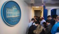 Reporters wait outside the White House Press Office on news of White House Press Secretary Sean Spicer's resignation at the White House in Washington, DC, on July 21, 2017. (AFP / JIM WATSON)