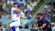 Los Angeles Dodgers’ Austin Barnes hits a single in the eighth inning against the Atlanta Braves at Dodger Stadium on Saturday. 