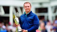 US golfer Jordan Spieth poses for a picture with the Claret Jug, the trophy for the Champion golfer of the year after winning the 2017 British Open Golf Championship at Royal Birkdale golf course near Southport in north west England, yesterday. 
