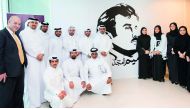ASTAD officials at the unveiling of a mural of Emir H H Sheikh Tamim bin Hamad Al Thani at the headquarters of the company.