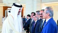 Emir H H Sheikh Tamim bin Hamad Al Thani with Turkish Foreign Minister Mevlut Cavusoglu (right) and members of the accompanying delegation of President of Turkey, Recep Tayyip Erdogan.