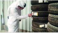 An official from the ministry examines tires at a shop in Industrial Area, yesterday. 