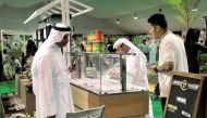 People buying vegan cake, juice and Ice cream made with organic dates at a stall at the second Local Dates Festival 2017 at Souq Waqif yesterday. (Pic: Kammutty VP / The Peninsula)