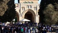 Palestinians gather near Jerusalem’s Old City as they enter the Al Aqsa Mosque following the removal of Israel's restrictions at the entrances to Al Aqsa Mosque in Jerusalem on July 28, 2017. (Enes Canl? - Anadolu Agency)