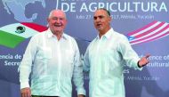 US Agriculture Secretary Sonny Perdue (left) and his Mexican counterpart Jose Calzada pose for pictures after offering a joint press conference in Merida, Yucatan State, Mexico. Perdue and Calzada met for talks on agricultural trade issues ahead of the re