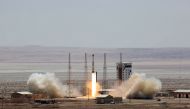 This file photo taken on July 26, 2017 shows a handout picture released by Iran's Defence Ministry shows a Simorgh (Phoenix) satellite rocket at its launch site at an undisclosed location in Iran. (AFP / IRANIAN DEFENCE MINISTRY / HO)