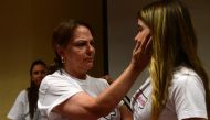Wife of prominent opposition leader and mayor of Caracas Antonio Jose Ledezma, Mitzy Capriles (L) consoles her daughter Antonieta after a press conference in Madrid on August 1, 2017 after her husband was arrested overnight by the Venezuelan intelligence 