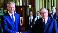 Italy’s Minister of the Economy and Finance Pier Carlo Padoan (right) shakes hands with his French counterpart Bruno Le Maire in Rome yesterday.