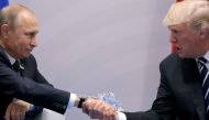US President Donald Trump shakes hands with Russian President Vladimir Putin during the their bilateral meeting at the G20 summit in Hamburg, Germany July 7, 2017. (REUTERS/Carlos Barria/File Photo)