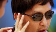 Origami Labs co-founder and CEO Kevin Wong and his visually impaired father Peter test an Orii smart ring at Hong Kong Cyberport in Hong Kong August 3 2017 Reuters/Bobby Yip