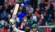 England’s Moeen Ali celebrates his half century on the third day of the fourth Test match between England and South Africa at Old Trafford in Manchester yesterday.