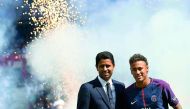Paris Saint-Germain’s Brazilian forward Neymar (right) poses with Paris Saint Germain’s (PSG) Qatari President Nasser Al Khelaifi during his presentation to the fans at the Parc des Princes Stadium in Paris, on Saturday. 