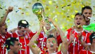 Bayern Munich’s players celebrates with the trophy after winning the Supercup final.