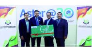 Officials of Aster holding a symbolic voucher.