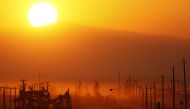 The sun rising over an oil field over the Monterey Shale formation where gas and oil extraction using hydraulic fracturing, or fracking, near Lost Hills, California, on March 23, 2014. AFP / Getty Images North America / David Mcnew 