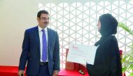 Dr Khaled Machaca, Associate Dean for Research at WCM-Q, presenting a certificate to one graduate. 