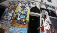 In this 2012  photo a man walks past an Internet cafe in Hamarweyne district of Somalian capital Mogadishu. Reuters / Ismail Taxta