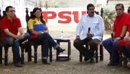 FILE PHOTO: Venezuela's  President Nicolas Maduro (2nd R), his wife Cilia Flores (2nd L) sit with brother of late President Hugo Chavez, governor of Barinas Adan Chavez (R), and President Chavez's son-in-law, Venezuela's Vice President Jorge Arreaza, as t