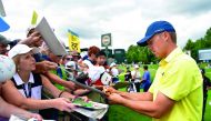Jordan Spieth of the United States signs autographs for fans during a practice round prior to the 2017 PGA Championship at Quail Hollow Club in Charlotte, North Carolina on Tuesday.